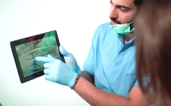 Stock Video Dentist Shows Patient Teeth On X Ray For PC
