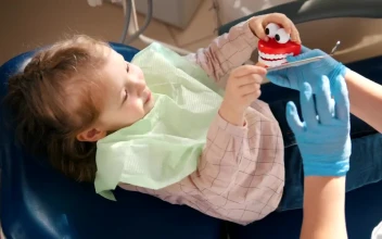 Stock Video Dentist Playing With A Little Patient With A Toy For PC