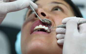 Stock Video Dentist Hands Cleaning Teeth Before Surgery For PC