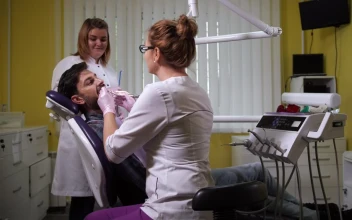 Stock Video Dental Assistant Working With A Patient For PC