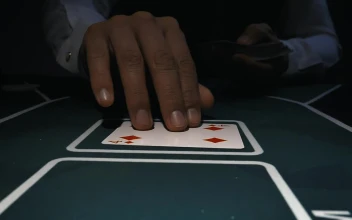 Stock Video Dealer Placing Poker Cards On A Gaming Table For PC