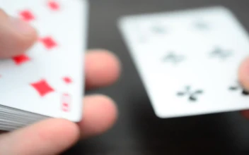 Stock Video Dealer Placing Cards On A Game Board For PC