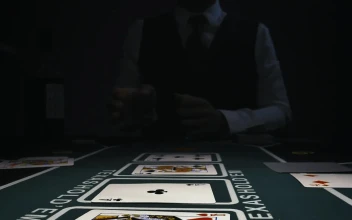 Stock Video Dealer Picking Up Cards From A Gaming Table For PC