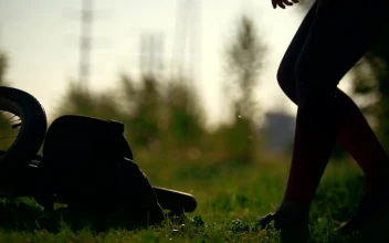 Stock Video Cyclist Woman Pulls Out Of The Backpack A Water Bottle For PC