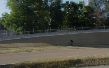 Stock Video Cyclist Traveling On A Track Outside For PC