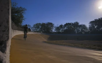 Stock Video Cyclist Riding A Track In A Park For PC