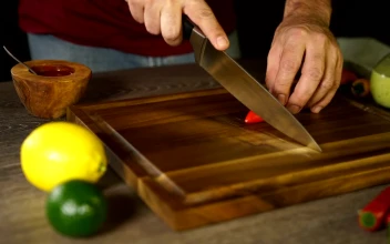 Stock Video Cutting Up A Chilli On A Board For PC