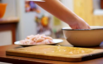 Stock Video Cutting Fresh Meat On A Board Close Up For PC