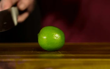 Stock Video Cutting A Lime In Half For Drinks For PC