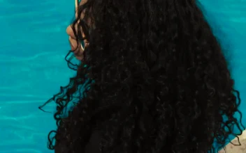 Stock Video Curly Haired Girl At A Pool Wearing Sunglasses For PC