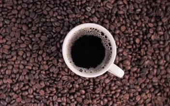 Stock Video Cup Of Coffee On Top Of Coffee Beans For PC