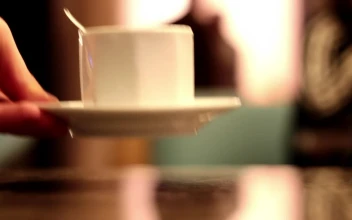 Stock Video Cup Of Coffee Delivered By A Waiter To A Diner For PC