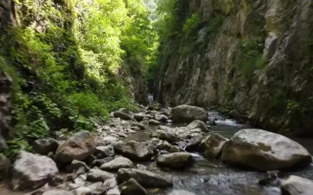 Stock Video Crossing A River Between Two Mountains For PC
