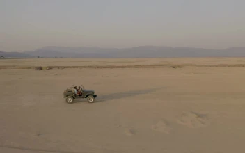 Stock Video Crossing A Desert By Truck At Sunset For PC