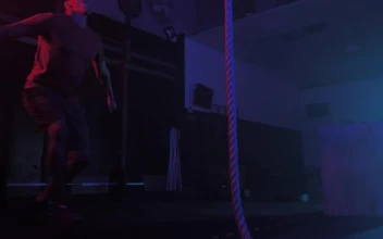 Stock Video Crossfit Man While Training Climbing A Rope For PC