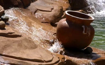 Stock Video Crock Pot Atop A Small Rock Waterfall For PC