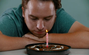 Stock Video Crestfallen Man Blowing Out The Candle On A Cake For PC