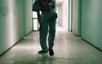Stock Video Creepy Zombie Male Nurse Approaching Down A Hallway For PC