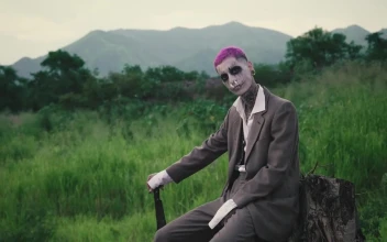 Stock Video Creepy Clown Sitting In Forest For PC