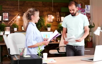 Stock Video Creatives Look Through Photo Ideas In Casual Office For PC
