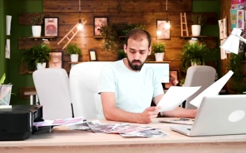 Stock Video Creative Man Prints Out Ideas In Home Office For PC