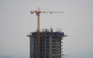 Stock Video Crane And Construction Workers At The Top Of A Building For PC