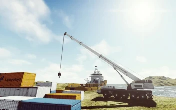 Stock Video Crane And A Cargo Ship In The Seashore For PC