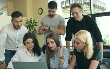 Stock Video Coworkers Looking At A Laptop In A Meeting For PC