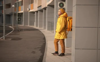 Stock Video Courier Man With Backpack Searching For Delivery Address For PC