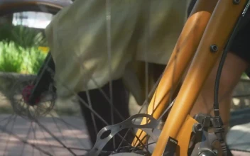 Stock Video Couple Walking Through A Park After A Bike Ride For PC