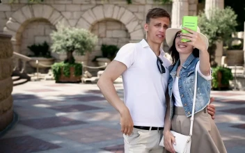 Stock Video Couple Taking Selfies During A Walk For PC