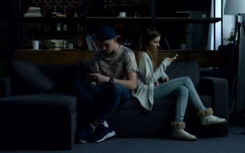 Stock Video Couple Sitting On A Sofa Back To Back For PC