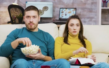Stock Video Couple Shows Fear While Watching Movie On Sofa For PC