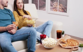 Stock Video Couple Sharing A Pizza And Popcorn For PC