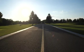 Stock Video Couple Riding Bikes Down A Road For PC