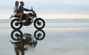 Stock Video Couple Riding A Motorcycle In The Beach For PC