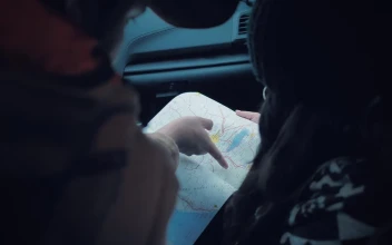 Stock Video Couple Reading A Map Inside A Car For PC