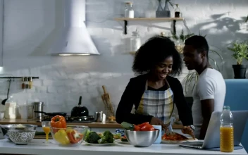 Stock Video Couple Preparing Food Following A Tutorial For PC