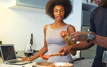 Stock Video Couple Preparing A Dish Watching A Cooking Tutorial For PC