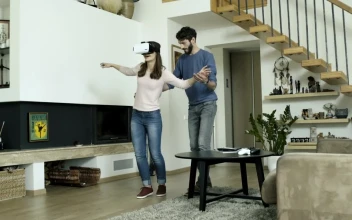 Stock Video Couple Playing With A Virtual Reality At Home For PC
