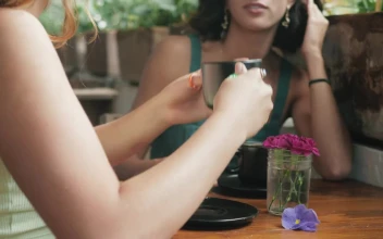 Stock Video Couple Of Girlfriends Drinking Coffee And Chatting In A Coffee For PC