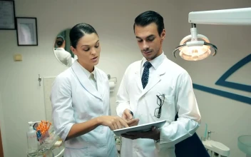 Stock Video Couple Of Dentists Checking An X Ray For PC