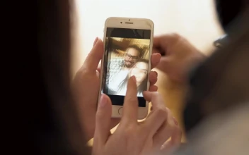 Stock Video Couple Looking At Selfies In Their Cell Phone For PC