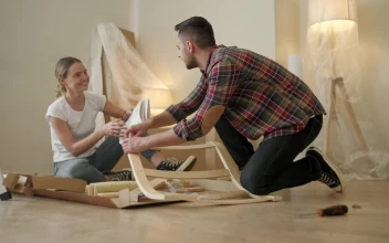 Stock Video Couple Look At Instructions While Assembling Furniture For PC