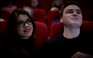 Stock Video Couple In Love Watching A Movie At The Cinema For PC