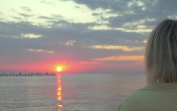 Stock Video Couple Hugging As The Sun Goes Down For PC