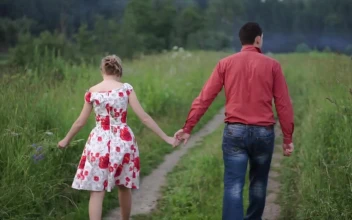 Stock Video Couple Holding Hands While Walking Outside For PC