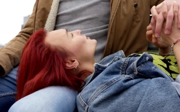 Stock Video Couple Holding Hands In A City Park For PC