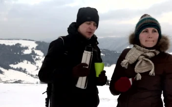 Stock Video Couple Having Tea In A Snowy Mountain Landscape For PC