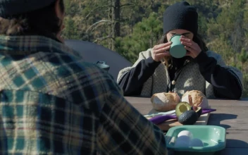 Stock Video Couple Having Breakfast In A Campsite For PC